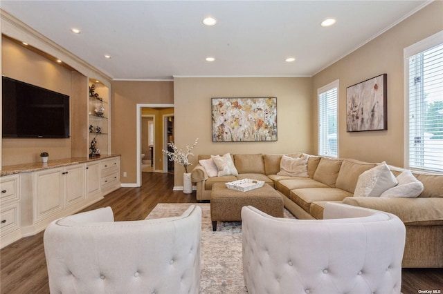 living area featuring recessed lighting, ornamental molding, baseboards, and wood finished floors