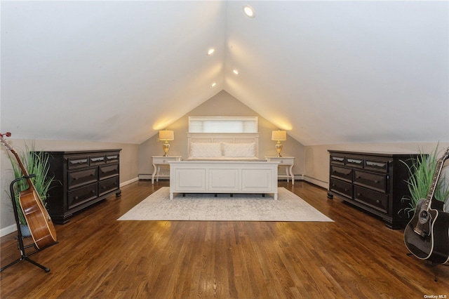 bedroom with baseboards, baseboard heating, wood finished floors, and vaulted ceiling