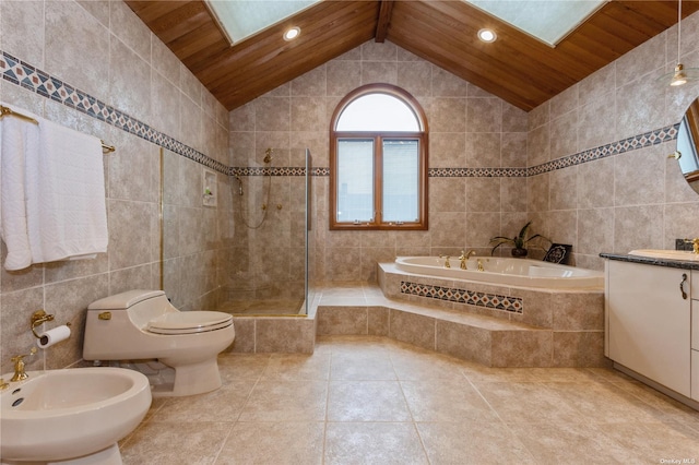 bathroom with tile walls, walk in shower, a bidet, a garden tub, and vanity