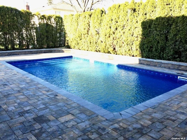 outdoor pool with a patio