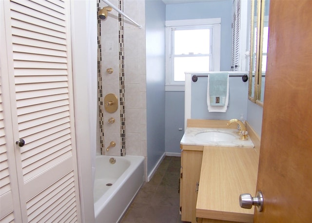 full bathroom with tile patterned floors, vanity, shower / bath combination, and baseboards