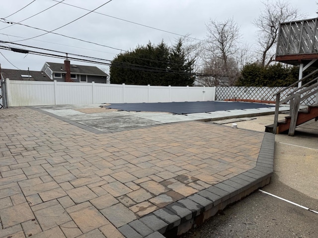 view of swimming pool with a patio area and a fenced backyard