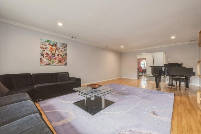 living area with recessed lighting, ornamental molding, baseboards, and wood-type flooring