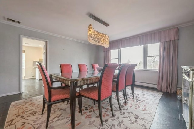 dining space with visible vents, crown molding, baseboards, and a baseboard radiator