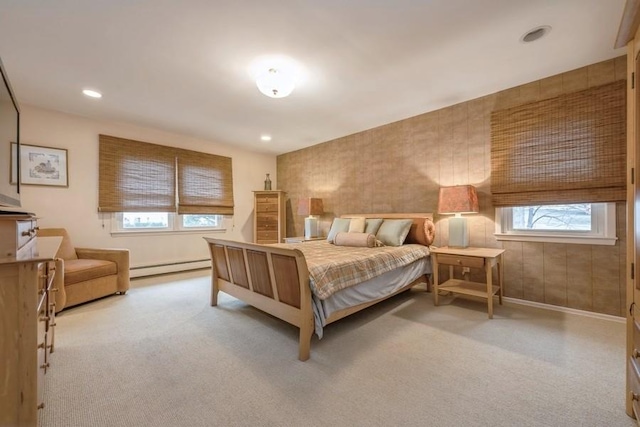 bedroom with recessed lighting, a baseboard heating unit, baseboards, and carpet