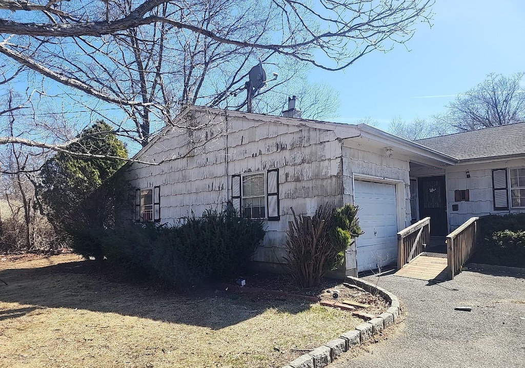 view of home's exterior with a garage