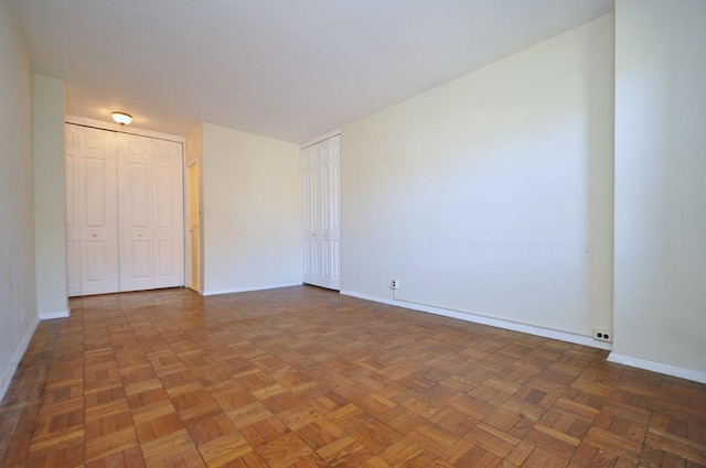 spare room featuring baseboards