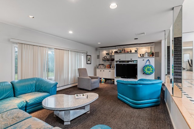 carpeted living area with visible vents, recessed lighting, stairs, and a baseboard radiator