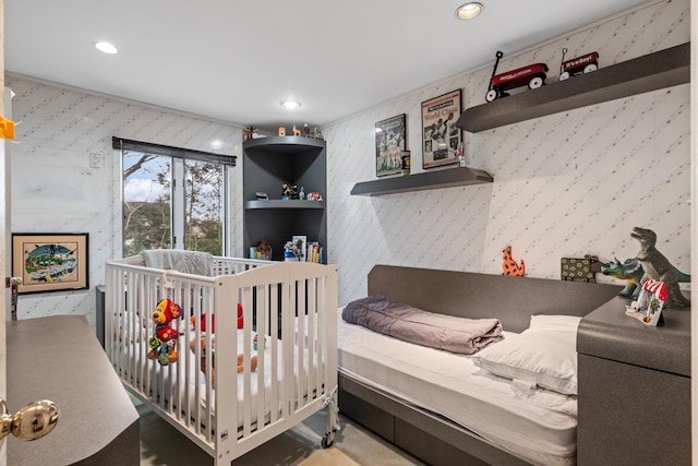 bedroom with recessed lighting and wallpapered walls