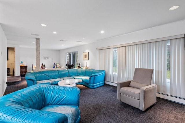 carpeted living room with baseboard heating and recessed lighting