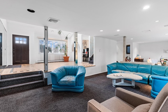 living room with recessed lighting, visible vents, baseboards, and a baseboard heating unit