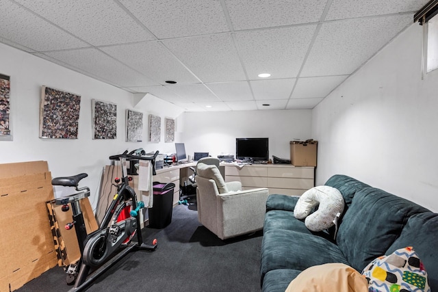 interior space featuring carpet flooring and a paneled ceiling