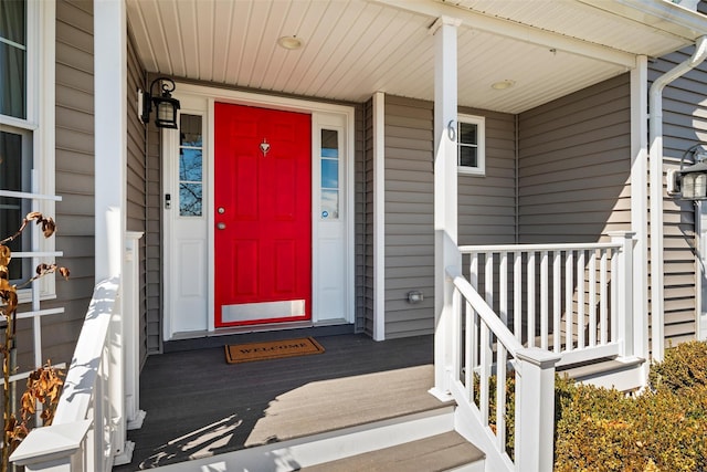 view of exterior entry featuring a porch