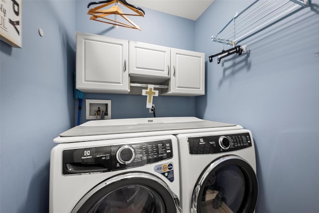 laundry area with cabinet space and washing machine and clothes dryer