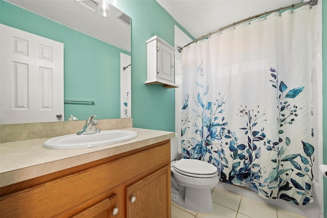 bathroom featuring tile patterned flooring, visible vents, toilet, vanity, and shower / bathtub combination with curtain