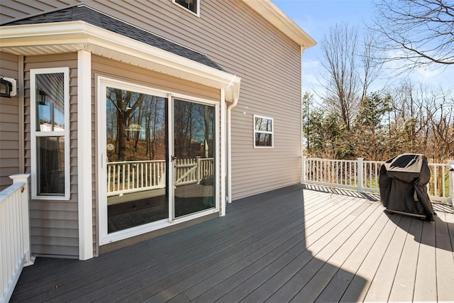 wooden deck featuring area for grilling