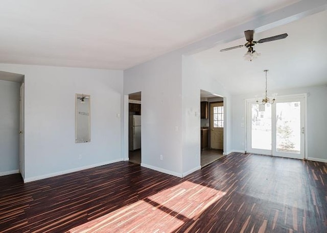 unfurnished living room featuring dark wood finished floors, lofted ceiling, and baseboards