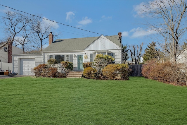 view of front facade with a garage, a front yard, a chimney, and fence