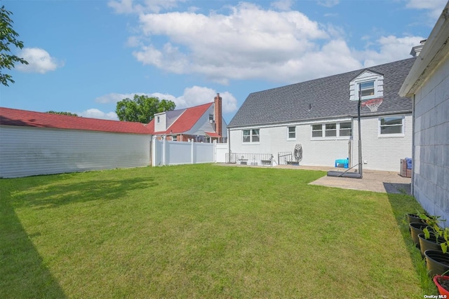 view of yard featuring a patio area and fence