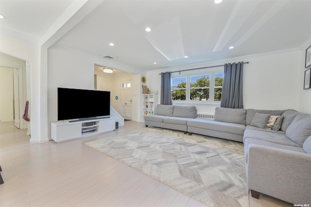 living room with visible vents, recessed lighting, ornamental molding, and wood finished floors