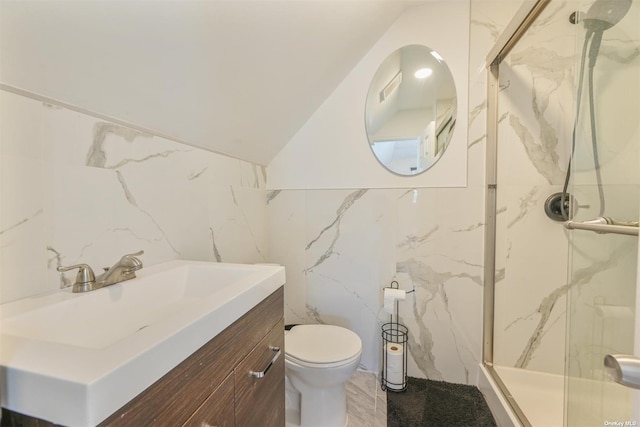 full bathroom featuring vanity, a marble finish shower, vaulted ceiling, tile walls, and toilet