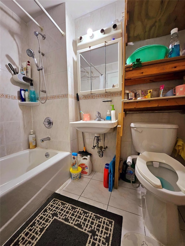 full bath with  shower combination, toilet, tile walls, and tile patterned floors