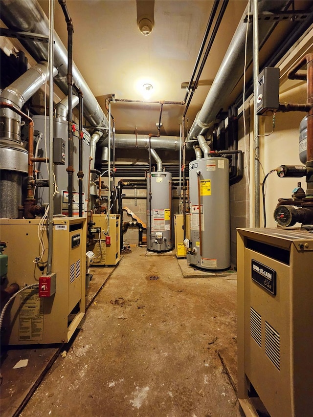 utility room featuring gas water heater and a heating unit