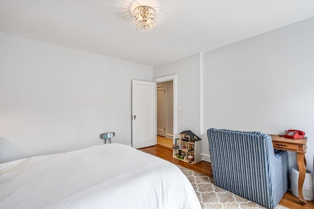 bedroom featuring wood finished floors