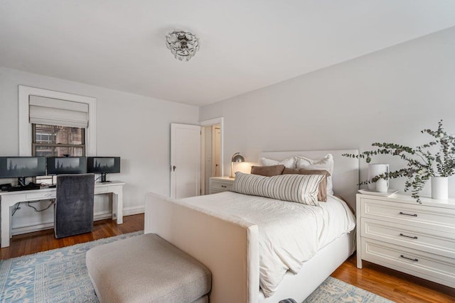 bedroom with wood finished floors