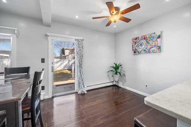 office area with dark wood-type flooring, recessed lighting, baseboards, baseboard heating, and ceiling fan