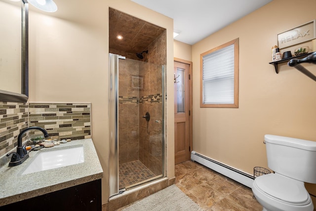 bathroom with vanity, a baseboard radiator, decorative backsplash, a shower stall, and toilet