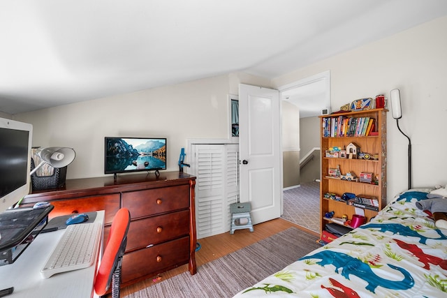 bedroom with wood finished floors