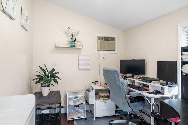 home office with vaulted ceiling and an AC wall unit