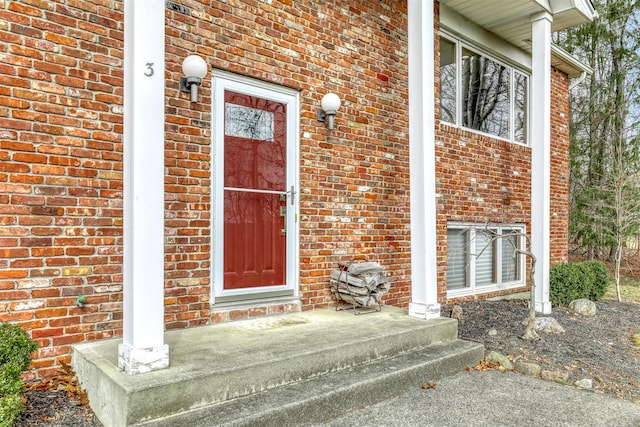 entrance to property with brick siding