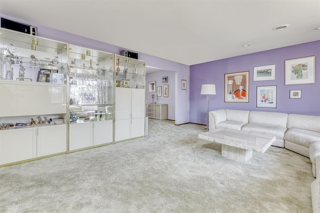 unfurnished living room with visible vents and carpet