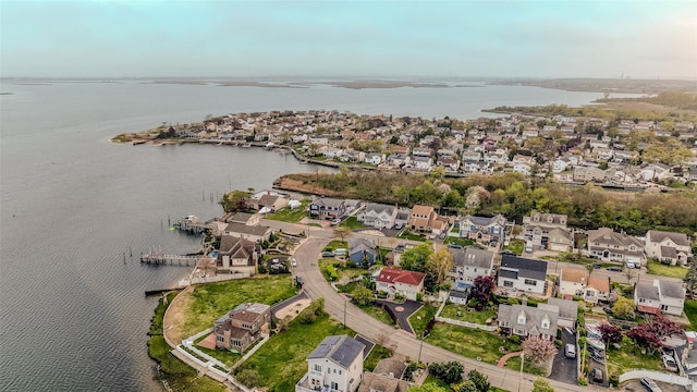 bird's eye view featuring a residential view and a water view