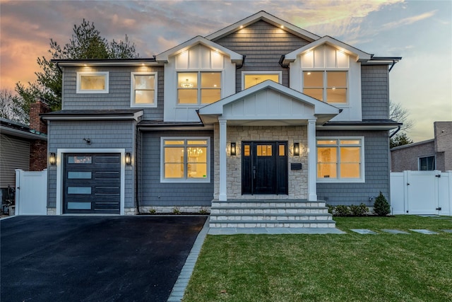 103 Frankel Blvd, Merrick, NY 11566 - view of front of house with a gate, a garage, and driveway