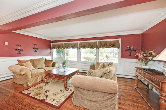 living area with crown molding, plenty of natural light, wood finished floors, and wainscoting