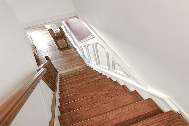 stairway featuring wood finished floors