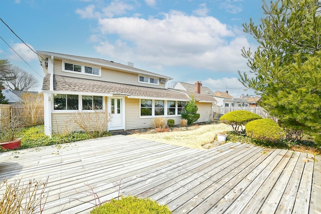 exterior space with fence private yard and a wooden deck