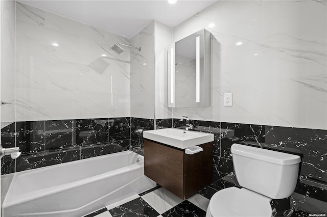 full bath with vanity, visible vents, bathtub / shower combination, tile walls, and toilet