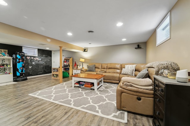 living room featuring recessed lighting, wood finished floors, and visible vents