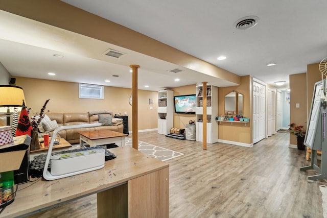 living area with recessed lighting, wood finished floors, visible vents, and baseboards