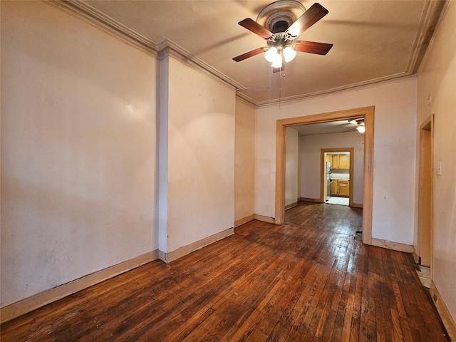 unfurnished room with ceiling fan, baseboards, hardwood / wood-style floors, and crown molding