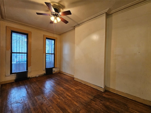 empty room with baseboards, wood-type flooring, a ceiling fan, and crown molding