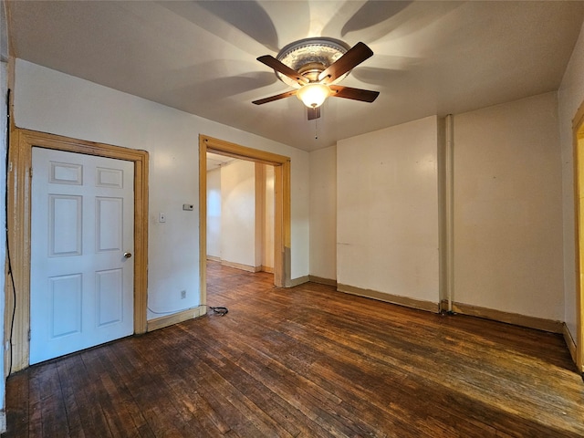 empty room with baseboards, ceiling fan, and hardwood / wood-style flooring