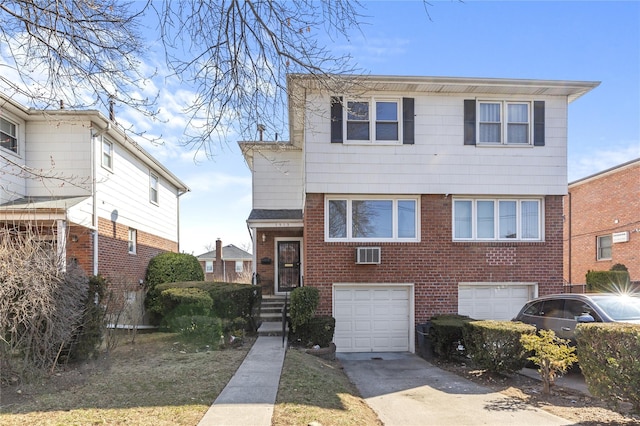 view of front of house featuring brick siding, driveway, and an attached garage