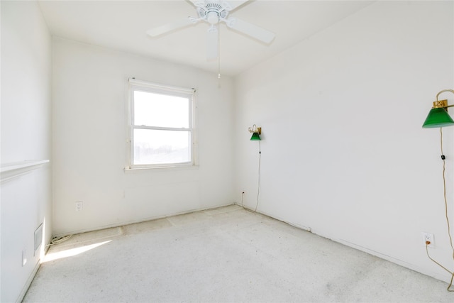 spare room with ceiling fan