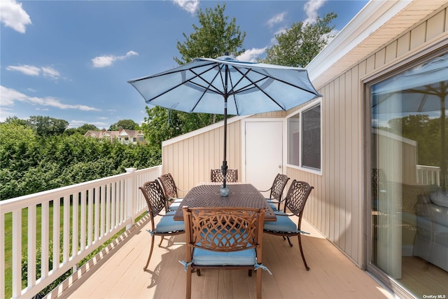 wooden deck with outdoor dining area