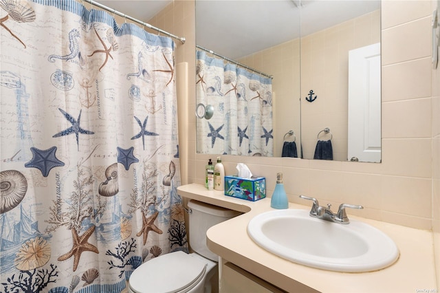 bathroom with vanity, a shower with curtain, tile walls, toilet, and tasteful backsplash